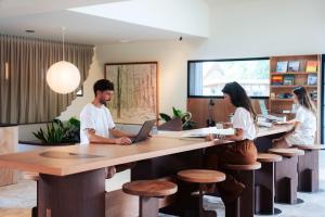 a group of people sitting at a desk in an office at Les Maritimes in Seignosse