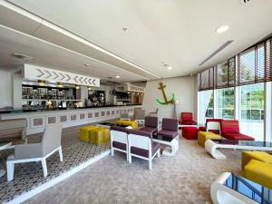 a lobby with colorful furniture and a bar at Catamaran Quality Times - Premium Ultra All Inclusive in Kemer