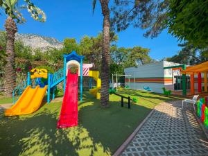 a playground with a slide in a park at Catamaran Quality Times - Premium Ultra All Inclusive in Kemer