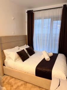 a bed in a bedroom with a large window at Tsavo rising in Nairobi