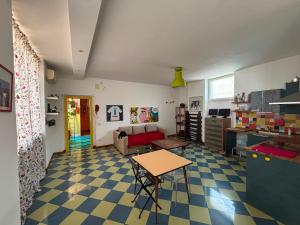 a living room with a table and a couch at Eco hostel floreale in Ercolano