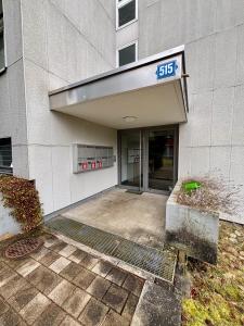 a building with a sign on the front of it at Basic Apartment in Witikon district in Zurich