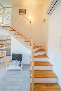a staircase in a home with a living room at Apartments TERRAeSAL in Zadar