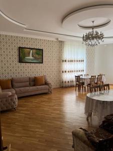 a living room with a couch and a table at House in Katex