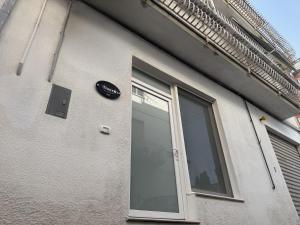 a building with a window and a sign on it at Casa Foscolo in San Salvo