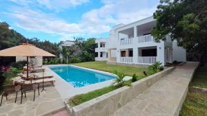 an image of a villa with a swimming pool at SaltSunRetreat Villa in Ukunda