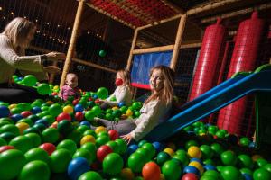 a group of children playing in a playground with balls at Quality Hotel Sarpsborg in Sarpsborg