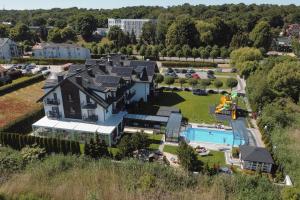 an aerial view of a house with a pool at Perla Mare Apartamenty in Krynica Morska