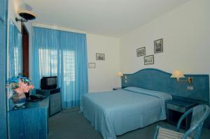 Voodi või voodid majutusasutuse Hotel Beny toas