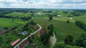 an aerial view of a building in a field at Green House Giławy in Giławy