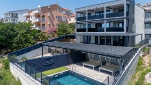 an aerial view of a house with a swimming pool at Villa Twins in Crikvenica