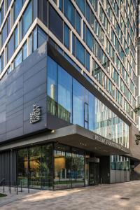 an office building with a large glass facade at Meliá Frankfurt City in Frankfurt