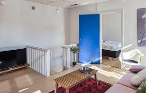 a living room with a couch and a table at 3 Bedroom Pet Friendly Apartment In Faaborg in Faaborg