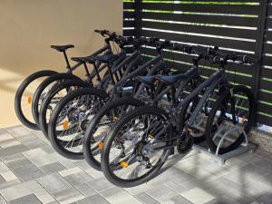 a row of bikes parked next to a wall at Villa Ante - Private Pool, Wellness & Gym in Šestanovac +79 photos