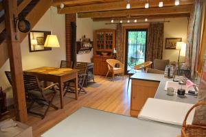 a kitchen and living room with a table and chairs at Bondyrz 134 in Bondyrz