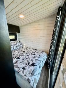 a bedroom with a bed in a room at Aurora Forest Cabin in Rovaniemi +13 photos