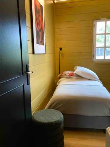 a bedroom with a bed in a yellow room at Villa Bourbon Pointu - Hiking & Spa in La Plaine des Palmistes +27 photos