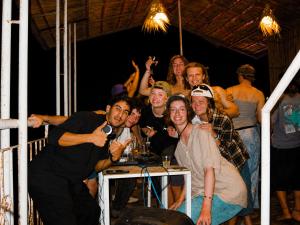 a group of people are posing for a picture at Santacruz Surf Camp Morocco in Tamraght Ouzdar