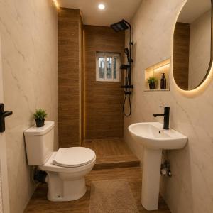 a bathroom with a toilet and a sink and a shower at Palazzo Apartments in Ikeja +25 photos