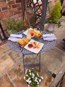 a table with food on it on a patio at The Cloud in Alderley Edge