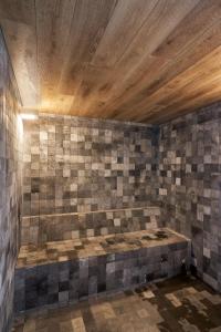 a room with a bed on a tiled wall at Almarena Puerto Retiro, Affiliated by Meliá in Buenos Aires +25 photos