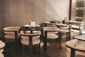 a row of tables and chairs in a restaurant at NH Collection San Sebastián Aranzazu in San Sebastián +37 photos