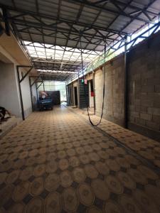 an empty room with ailed floor in a building at Aziz House in Naryn