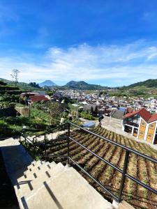 a view of a city from the top of a hill at Oemah Ntuy Full view in Diyeng
