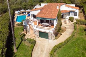 an aerial view of a house with a swimming pool at Villa Alondra B6 by BookMenorcaVillas in Santo Tomás
