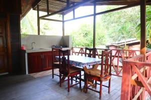a kitchen and dining room with a table and chairs at Executive Suites & Apartments - VIP Services in Kribi