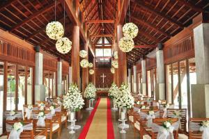 a banquet hall with tables and chairs and flowers at JW Marriott Phuket Resort and Spa in Mai Khao Beach +268 photos