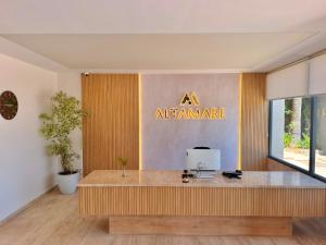 an office with aamine sign on the wall at Altamare Hotel in Kuşadası +47 photos