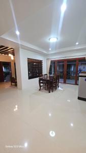 a dining room with a table and chairs at Chaya village F shared pool jacuzzi in Phra Ae beach