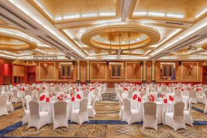 a banquet hall with tables and chairs in a room at Kempinski Hotel Shenzhen in Shenzhen +185 photos