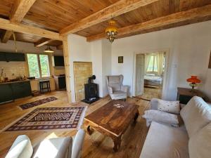 a living room with a couch and a table at Leśna Kraina in Międzyrzec Podlaski