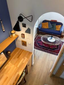 a living room with a couch and a table at studio 25 in Dinard