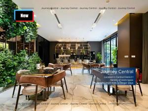 a restaurant with tables and chairs in a lobby at Journey Central - ZENITY & D1 MENSION in Ho Chi Minh City