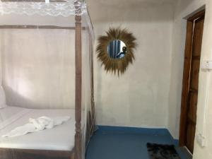 a bedroom with a bunk bed with a mirror at Nanakizilodge in Mtendeni