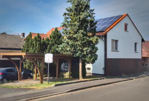 a house with solar panels on the roof at Der Teichhof in Grandenborn