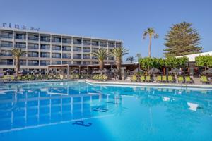 a large swimming pool in front of a hotel at SOL by Meliá Marina Beach Crete in Gouves +92 photos