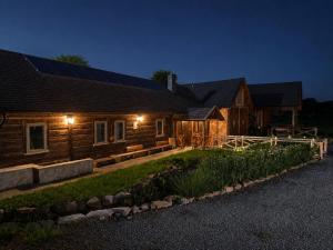 a house with solar panels on it at night at Kachlówka in Lachowice