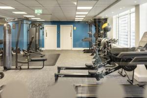 a gym with treadmills and machines in a room at Albert Court in Liverpool in Liverpool
