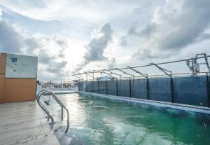 a swimming pool on top of a cruise ship at Hotel Sea Wood in Digha