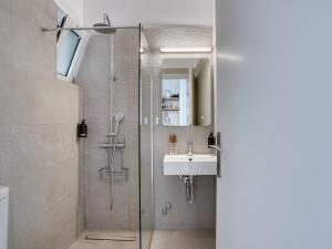 a bathroom with a shower and a sink at Pittas Studios in Kardamaina +42 photos