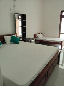 a bedroom with two beds in a room at Yala Villa Harmony in Debarawewa