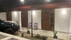 a garage with two chairs and a truck parked in it at Yala Villa Harmony in Debarawewa