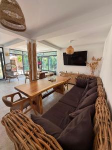 a living room with a couch and a table at Smochin Vama Veche Adults Only in Vama Veche