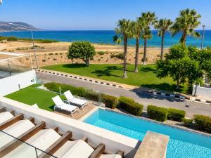 a view of a swimming pool and the ocean at Villa Celestia in Neo Chorio