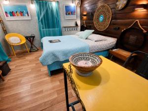 a room with two beds and a table with a bowl on it at dream tiny house & luxury tent in Chania +46 photos