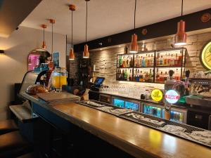 a bar in a restaurant with a counter top at Marena Wellness & Spa in Międzywodzie